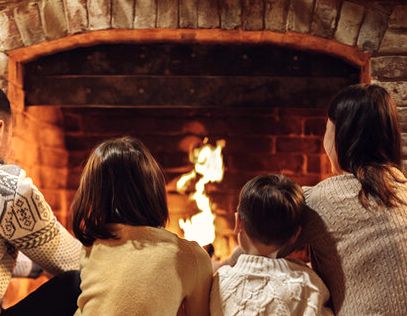 Family by the evening fire