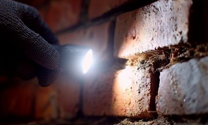 Joint scanned by lamplight during a leak hunt